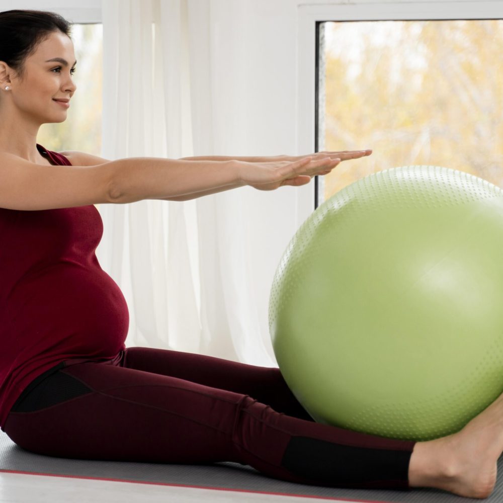 pregnant-young-woman-exercising-with-fitness-ball